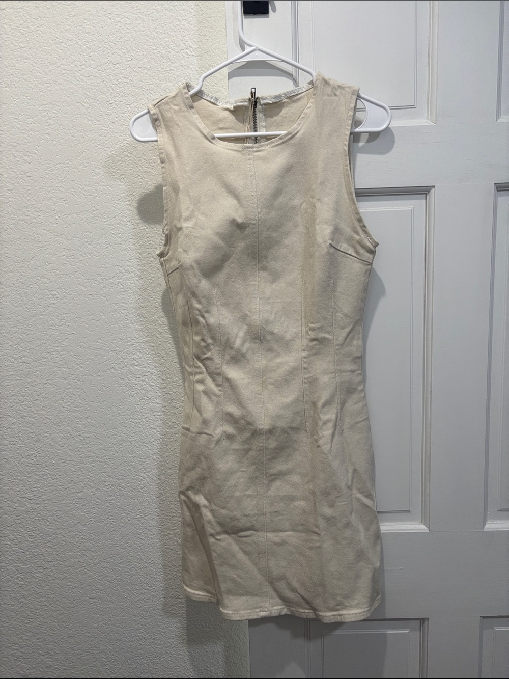 Sleeveless Cream Mini Dress with Clean Lines